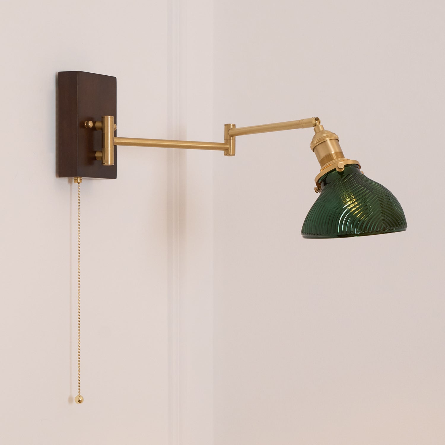 Emeric Adjustable Swing Arm Wall Lamp with Green Glass Shade - Neutralighting