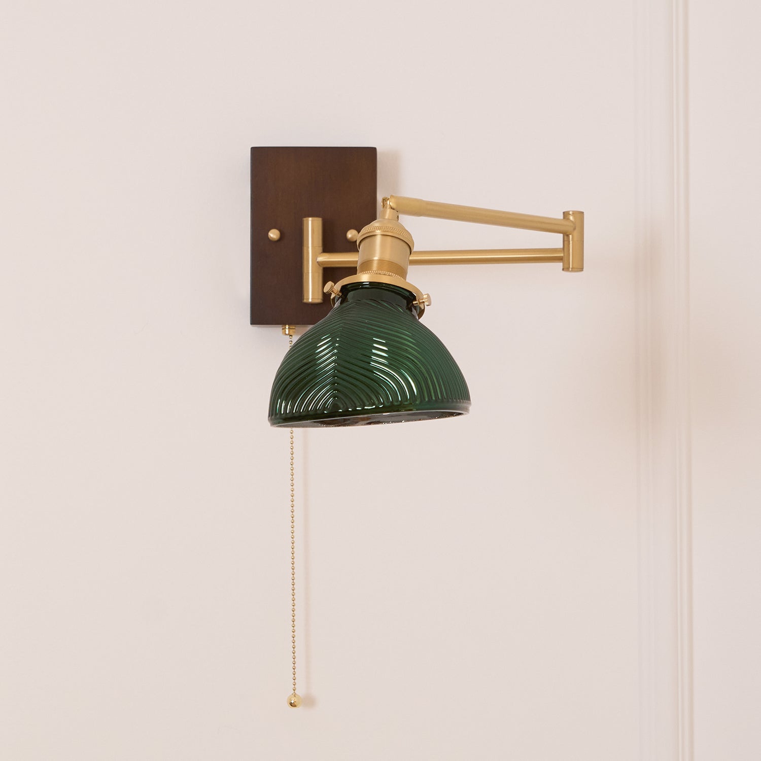 Emeric Adjustable Swing Arm Wall Lamp with Green Glass Shade - Neutralighting